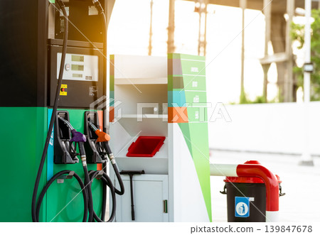 Petrol pump filling fuel nozzle in gas station. Fuel dispenser machine. Refuel fill up with petrol gasoline. Petrol industry and service. Petrol price and oil crisis concept. Petroleum oil industry. Petrol pump filling fuel nozzle in gas station. Fuel dispenser machine. Refuel fill up with petrol gasoline. Petrol industry and service. Petrol price and oil crisis concept. Petroleum oil industry. 139847678