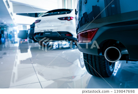 Car parked in luxury showroom. Car dealership office. Car showroom business. New car parked in modern showroom. Auto for sale and rent business. Automobile leasing and insurance. Electric automobile. 139847698