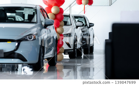 Car parked in luxury showroom. Car dealership office. Car showroom business. New car parked in modern showroom. Auto for sale and rent business. Automobile leasing and insurance. Electric automobile. Car parked in luxury showroom. Car dealership office. Car showroom business. New car parked in modern showroom. Auto for sale and rent business. Automobile leasing and insurance. Electric automobile. 139847699