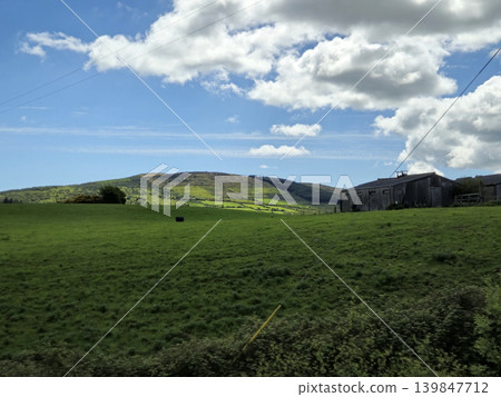 Beautiful Green Valley And Fields Of Ireland Under Deep Blue Summer Sky Natural Background Beautiful Green Valley And Fields Of Ireland Under Deep Blue Summer Sky Natural Background 139847712