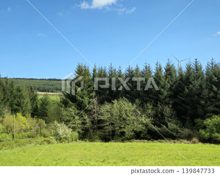 Beautiful Green Valley And Fields Of Ireland Under Deep Blue Summer Sky Natural Background Beautiful Green Valley And Fields Of Ireland Under Deep Blue Summer Sky Natural Background 139847733