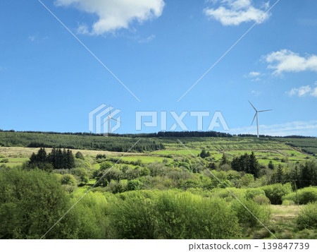 Beautiful Green Valley And Fields Of Ireland Under Deep Blue Summer Sky Natural Background Beautiful Green Valley And Fields Of Ireland Under Deep Blue Summer Sky Natural Background 139847739