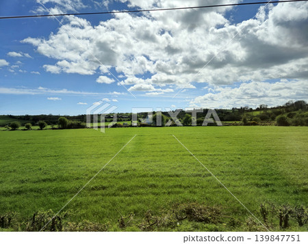 Beautiful Green Valley And Fields Of Ireland Under Deep Blue Summer Sky Natural Background Beautiful Green Valley And Fields Of Ireland Under Deep Blue Summer Sky Natural Background 139847751