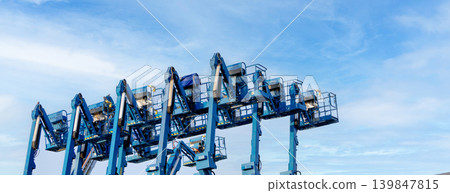 Articulated boom lift. Aerial platform lift. Telescopic boom lift against clear sky. Mobile construction crane for rent and sale. Maintenance and repair hydraulic boom lift service. Crane dealership. Articulated boom lift. Aerial platform lift. Telescopic boom lift against clear sky. Mobile construction crane for rent and sale. Maintenance and repair hydraulic boom lift service. Crane dealership. 139847815
