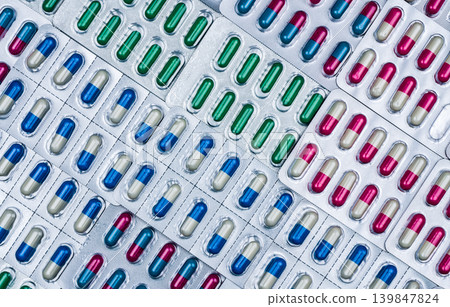Capsule pills in blister packaging, pharmaceutical manufacturing and drug production. Quality control and global healthcare industry. Packaging technology, quality inspection. Healthcare supply chain. 139847824