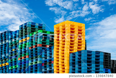 Pile of plastic shipping pallet. Industrial plastic pallet stacked at factory warehouse. Cargo and shipping concept. Plastic pallet rack for export delivery industry. Plastic pallet storage warehouse. 139847840