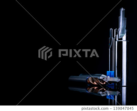Special tools isolated on black background. Made to order special tools. Coated step drill and reamer detail. HSS cemented carbide. Carbide cutting tool for industrial applications. Engineering tools. Special tools isolated on black background. Made to order special tools. Coated step drill and reamer detail. HSS cemented carbide. Carbide cutting tool for industrial applications. Engineering tools. 139847845