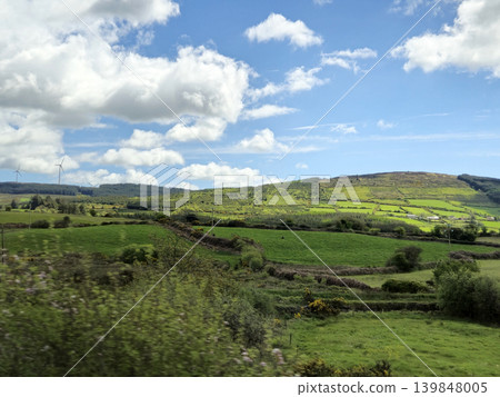 Beautiful Green Valley And Fields Of Ireland Under Deep Blue Summer Sky Natural Background Beautiful Green Valley And Fields Of Ireland Under Deep Blue Summer Sky Natural Background 139848005