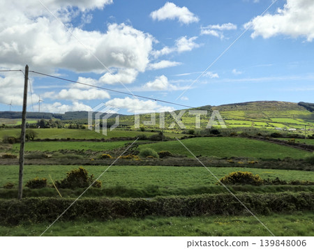 Beautiful Green Valley And Fields Of Ireland Under Deep Blue Summer Sky Natural Background Beautiful Green Valley And Fields Of Ireland Under Deep Blue Summer Sky Natural Background 139848006