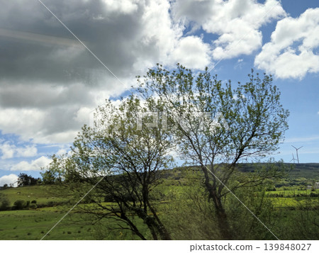 Beautiful Green Valley And Fields Of Ireland Under Deep Blue Summer Sky Natural Background Beautiful Green Valley And Fields Of Ireland Under Deep Blue Summer Sky Natural Background 139848027