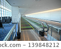 Moving walkways and modern corridors within the airport terminal 139848212