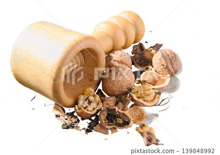 Wooden Nutcracker With Cracked Walnuts and Shells, Rustic Kitchen Tool and Healthy Snack Ingredients 139848992
