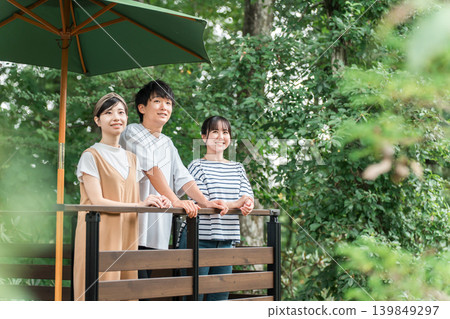 A group of men and women refreshing themselves in nature during holidays and summer vacation. A group of men and women refreshing themselves in nature during holidays and summer vacation. 139849297