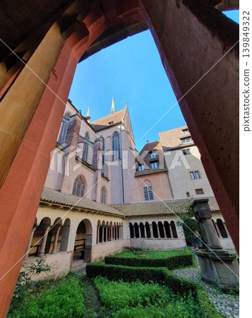 Phone photo of the cloister of Saint-Pierre-le-Jeune Protestant Church. Historic architecture scene showing medieval stone arches, peaceful courtyard, and European heritage. Phone photo of the cloister of Saint-Pierre-le-Jeune Protestant Church. Historic architecture scene showing medieval stone arches, peaceful courtyard, and European heritage. 139849322