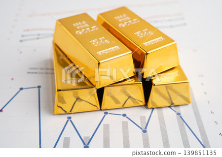 Gold bars on graph paper, finance trading investment business currency. 139851135