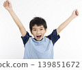 Happy boy in  t-shirt raising hands up 139851672