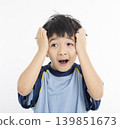 The boy's embarrassed expression 139851673
