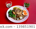 A plate of khao kha mu with garlic and chili, served at a small family restaurant in Bangkok 139851901