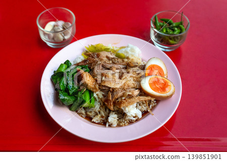 A plate of khao kha mu with garlic and chili, served at a small family restaurant in Bangkok A plate of khao kha mu with garlic and chili, served at a small family restaurant in Bangkok 139851901