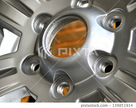 Closeup alloy wheel rim showcasing polished metallic spokes Closeup alloy wheel rim showcasing polished metallic spokes 139851914