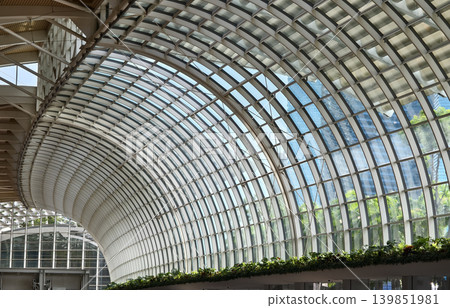 Glass canopy showcasing repeating geometric frames and day light Glass canopy showcasing repeating geometric frames and day light 139851981