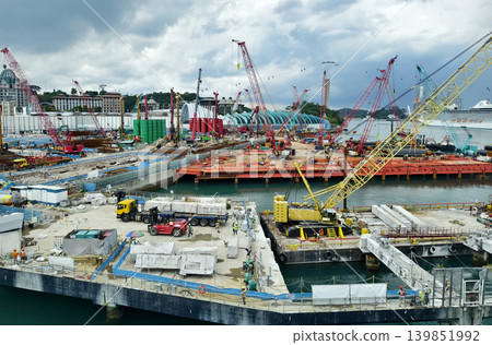 Active construction team erects building with tools and supports Active construction team erects building with tools and supports 139851992