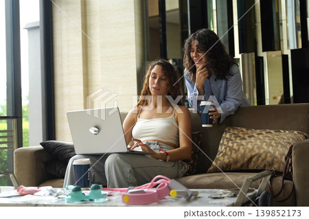 Two young women run a blog and sell massagers through a website 139852173