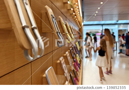 Lively pastel colored phone cases hang systematically displaying diverse textures and styles Lively pastel colored phone cases hang systematically displaying diverse textures and styles 139852335