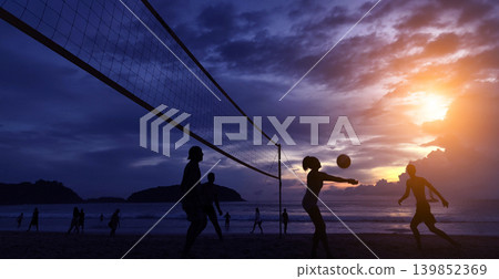 Young people playing beach volleyball by the ocean at sunset Young people playing beach volleyball by the ocean at sunset 139852369