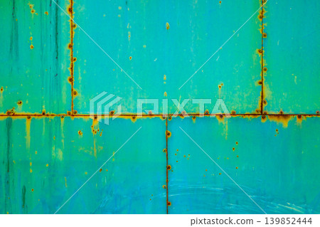 Rusted Teal Metal Surface with Rivets 139852444