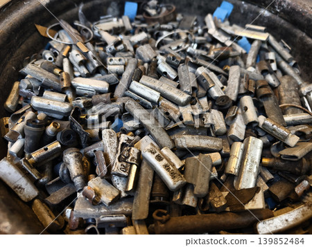 Pile of rusted motor components and gears in cluttered scrap heap Pile of rusted motor components and gears in cluttered scrap heap 139852484