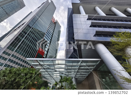 Innovative business exterior emphasizing environmentally friendly resources and abundant greenery Innovative business exterior emphasizing environmentally friendly resources and abundant greenery 139852702