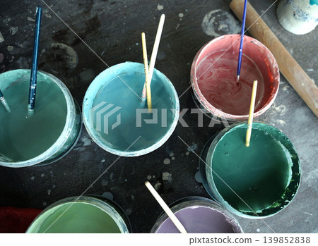 Cans of paint on a table in a ceramics workshop Cans of paint on a table in a ceramics workshop 139852838