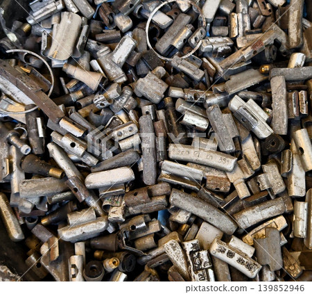 Pile of rusted motor components and gears in cluttered scrap heap Pile of rusted motor components and gears in cluttered scrap heap 139852946