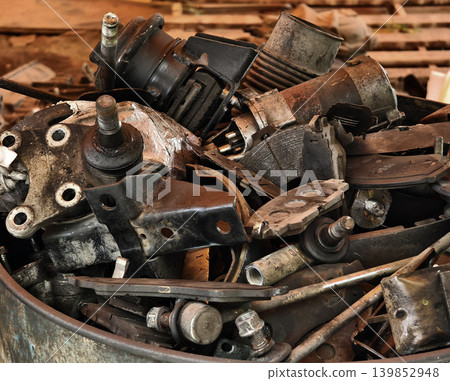 Pile of rusted motor components and gears in cluttered scrap heap Pile of rusted motor components and gears in cluttered scrap heap 139852948