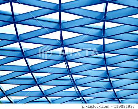 Glass canopy showcasing repeating geometric frames and day light Glass canopy showcasing repeating geometric frames and day light 139852955