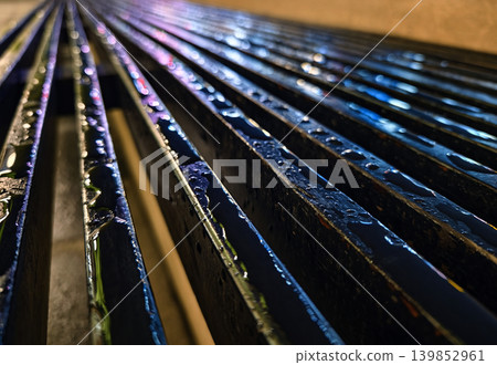 Closeup of shiny metallic panels illuminated by neon lights in city night atmosphere 139852961