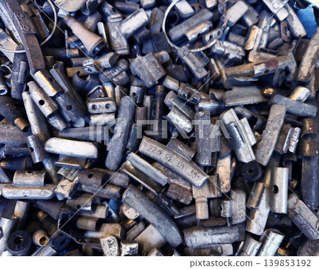 Pile of rusted motor components and gears in cluttered scrap heap Pile of rusted motor components and gears in cluttered scrap heap 139853192