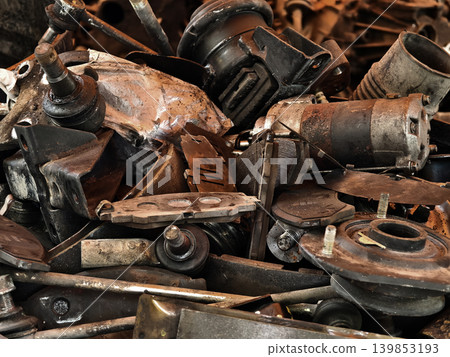 Pile of rusted motor components and gears in cluttered scrap heap Pile of rusted motor components and gears in cluttered scrap heap 139853193