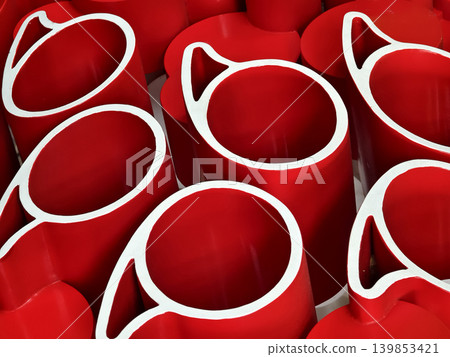 red paper rolls tightly arranged forming layered spiral shapes with white inner edges red paper rolls tightly arranged forming layered spiral shapes with white inner edges 139853421