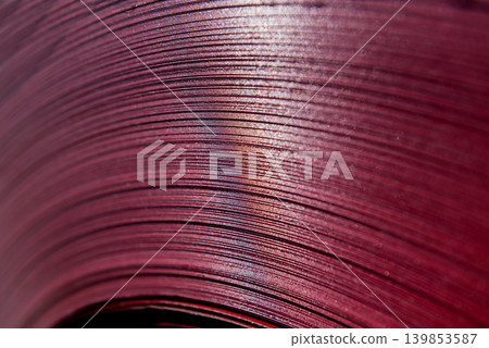 Curved lines of rolled metal are made of sheet steel. 139853587