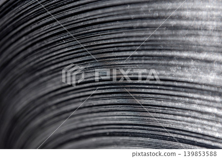 Curved lines of rolled metal are made of sheet steel. Curved lines of rolled metal are made of sheet steel. 139853588