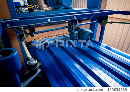 Metal sheet forming machine at the modern metalwork factory. Metal sheet forming machine at the modern metalwork factory. 139853589