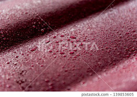 Red metallic roof tiles background with drops of water. 139853605