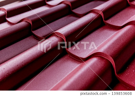 Red metallic roof tiles background with drops of water. 139853608