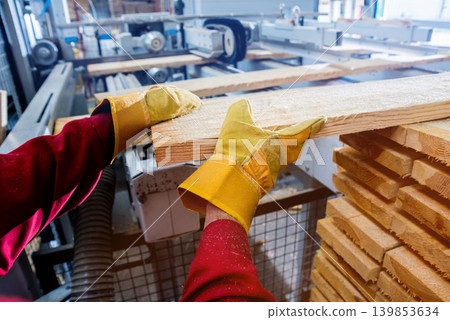 Carpenter with fibreboards at furniture factory workshop. Woodworking industry Carpenter with fibreboards at furniture factory workshop. Woodworking industry 139853634
