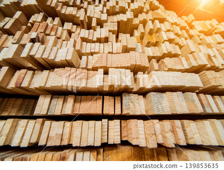 Stack of natural rough wooden boards. Wooden boards, lumber, industrial wood. Stack of natural rough wooden boards. Wooden boards, lumber, industrial wood. 139853635