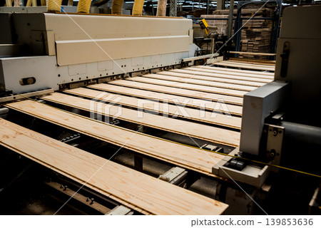 Production line of the wooden floor factory. CNC automatic woodworking machine. Production line of the wooden floor factory. CNC automatic woodworking machine. 139853636