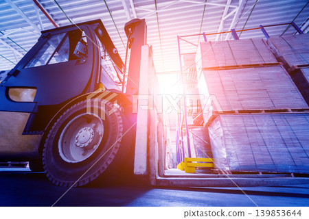 Forklift loader in storage warehouse ship yard. Distribution products. Forklift loader in storage warehouse ship yard. Distribution products. 139853644