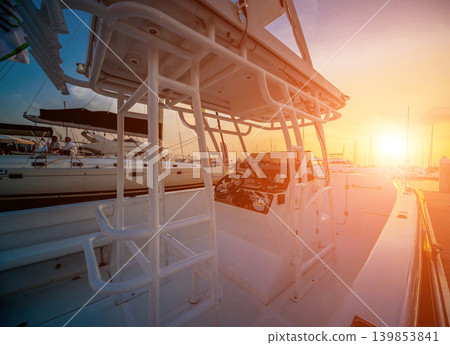 A modern speed boat yacht steering wheels. A modern speed boat yacht steering wheels. 139853841